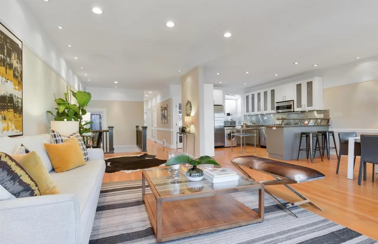 Open-concept living, dining, and kitchen renovation in a restored Edwardian condo in San Francisco’s Lower Haight.