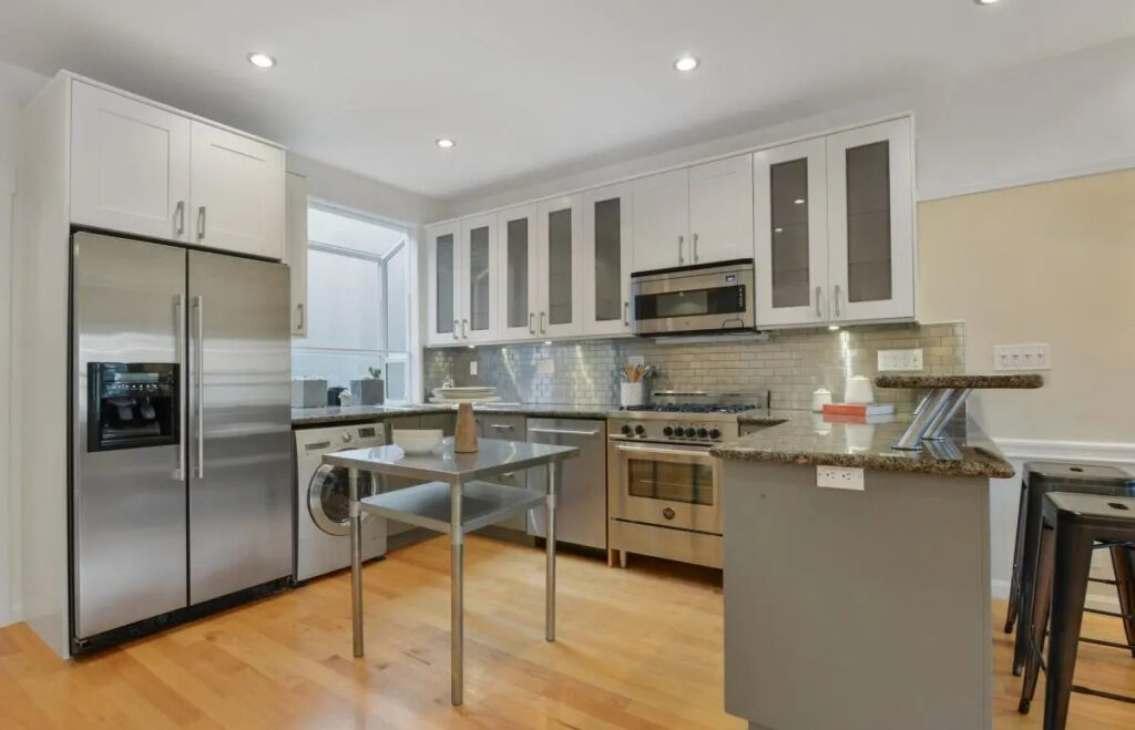 Contemporary kitchen remodel featuring stainless steel appliances, modern cabinetry, and granite countertops in San Francisco’s Lower Haight.