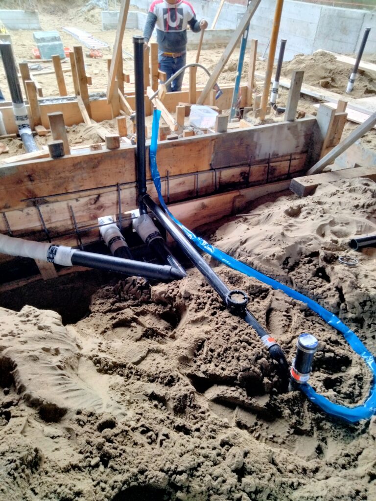 ABS floor drain rough-in with backflow valve and trap primer in San Francisco groundwork plumbing.