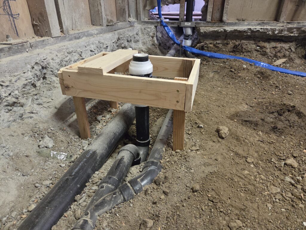 Shower drain rough-in with horizontal vent and ABS piping in San Francisco groundwork plumbing.