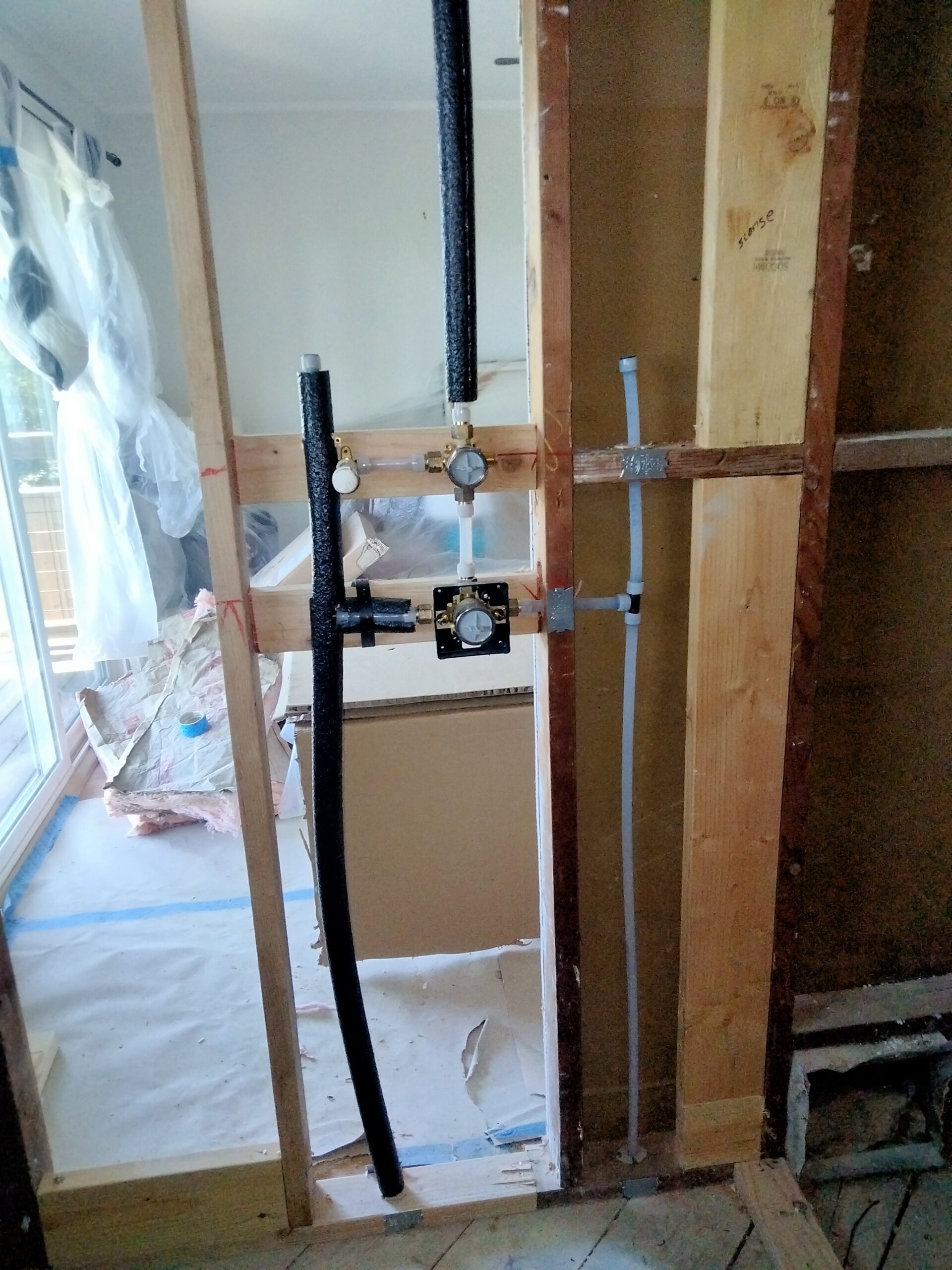 Delta shower valve with two-way diverter and PEX rough-in plumbing installed in San Francisco bathroom remodel.