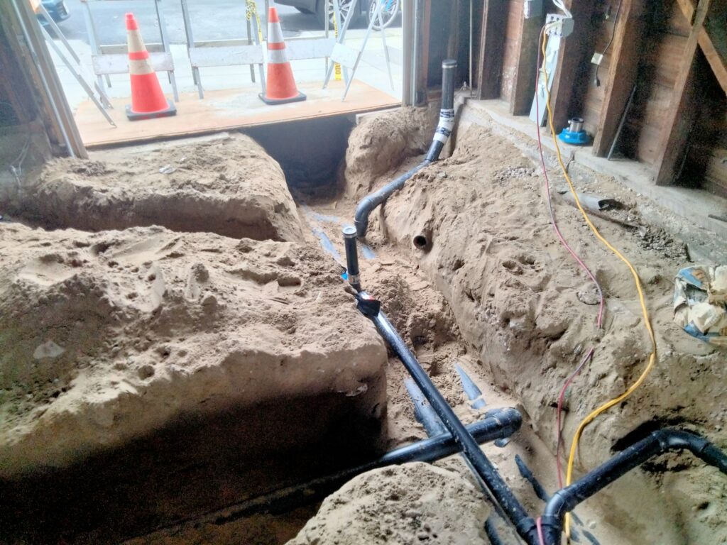 Combined DWV and storm drain groundwork connection to San Francisco city sewer lateral.