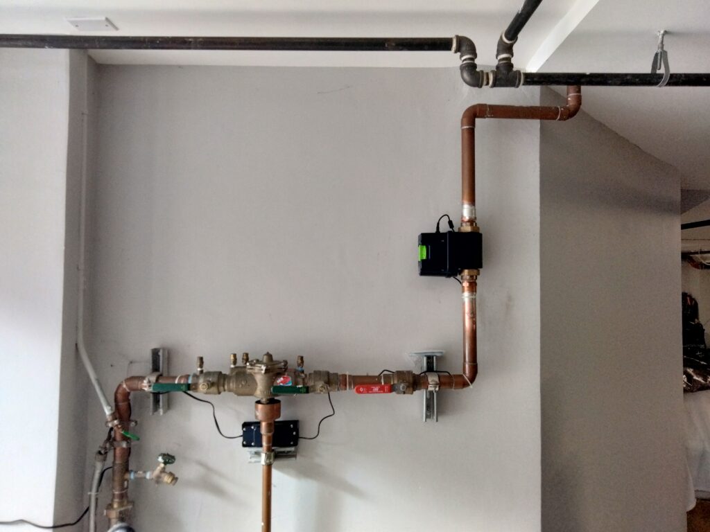 1.5-inch Moen Flo smart water shutoff installation on copper and cast-iron plumbing in San Francisco home.