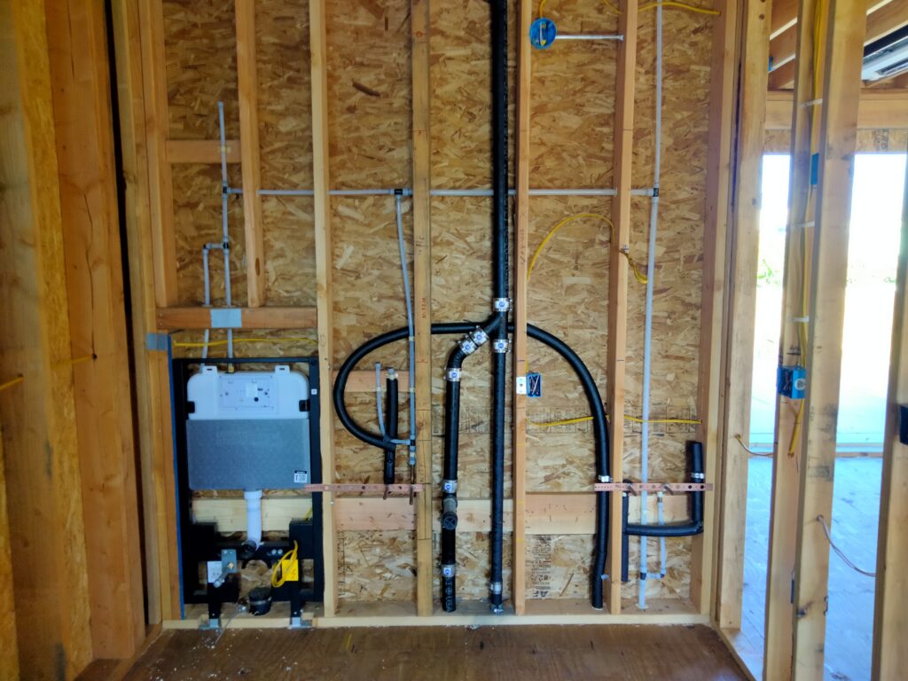 Cast iron and PEX top-out with Duravit WC carrier and double lav stub-outs in Bay Area remodel.