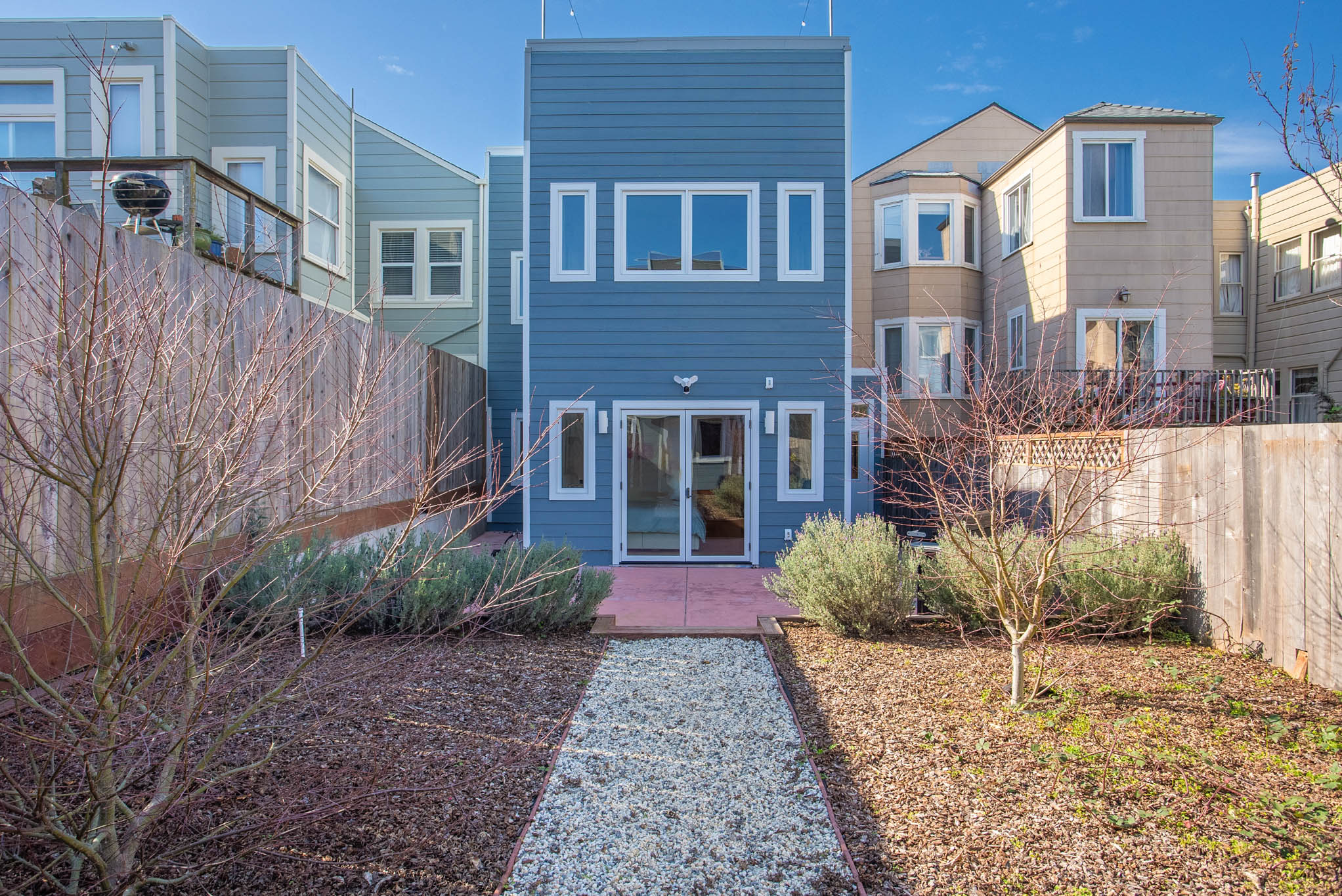 Backyard walkway leading to the rear entry of a Richmond District San Francisco house remodel